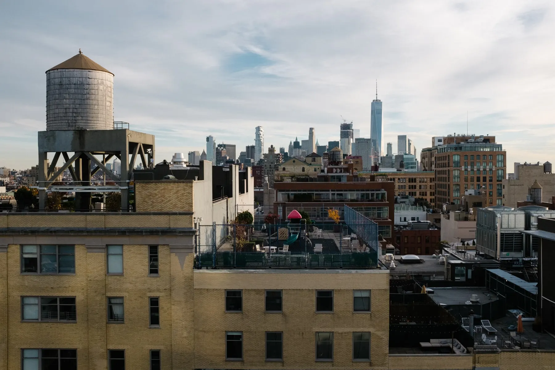 Rooftop water tank with the Lower Manhattan skyline behind