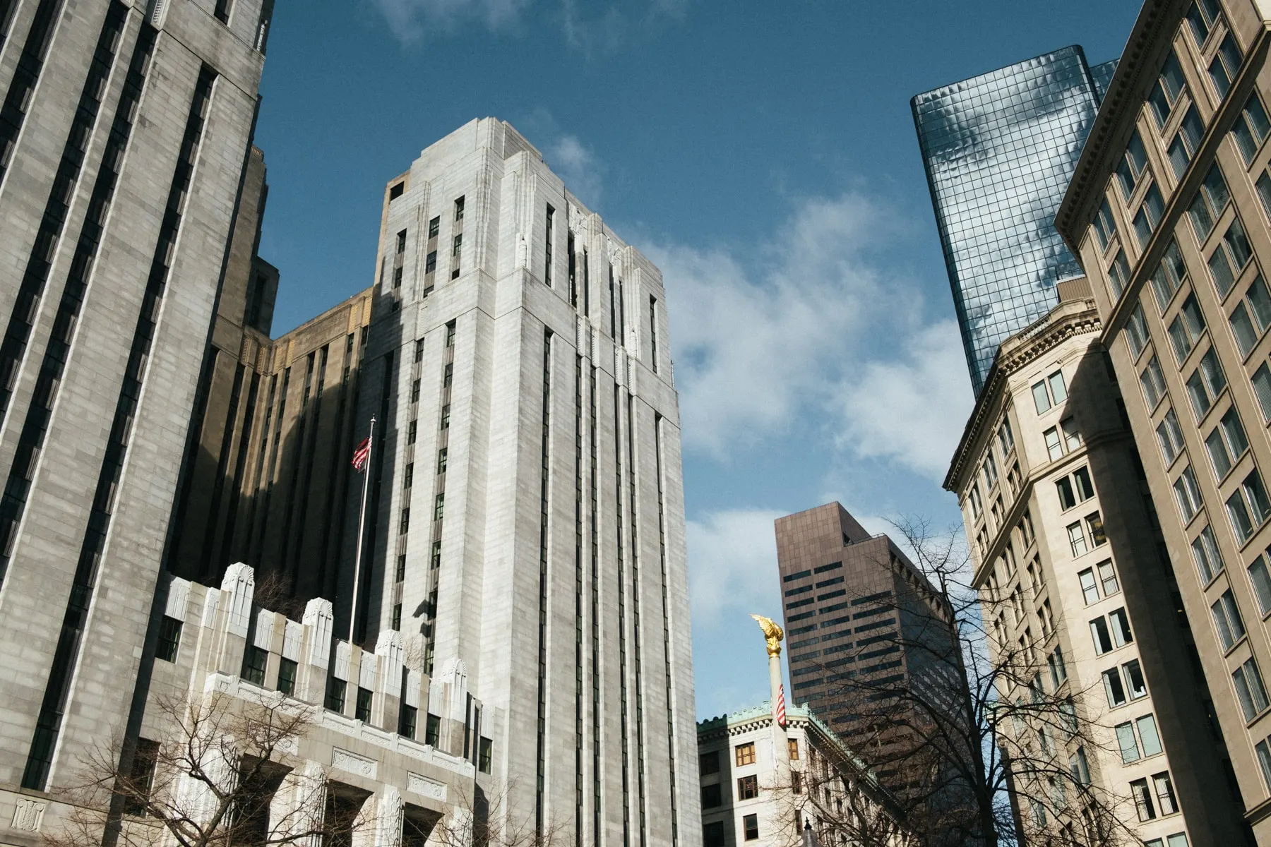 Art deco tower and glass tower seen from below